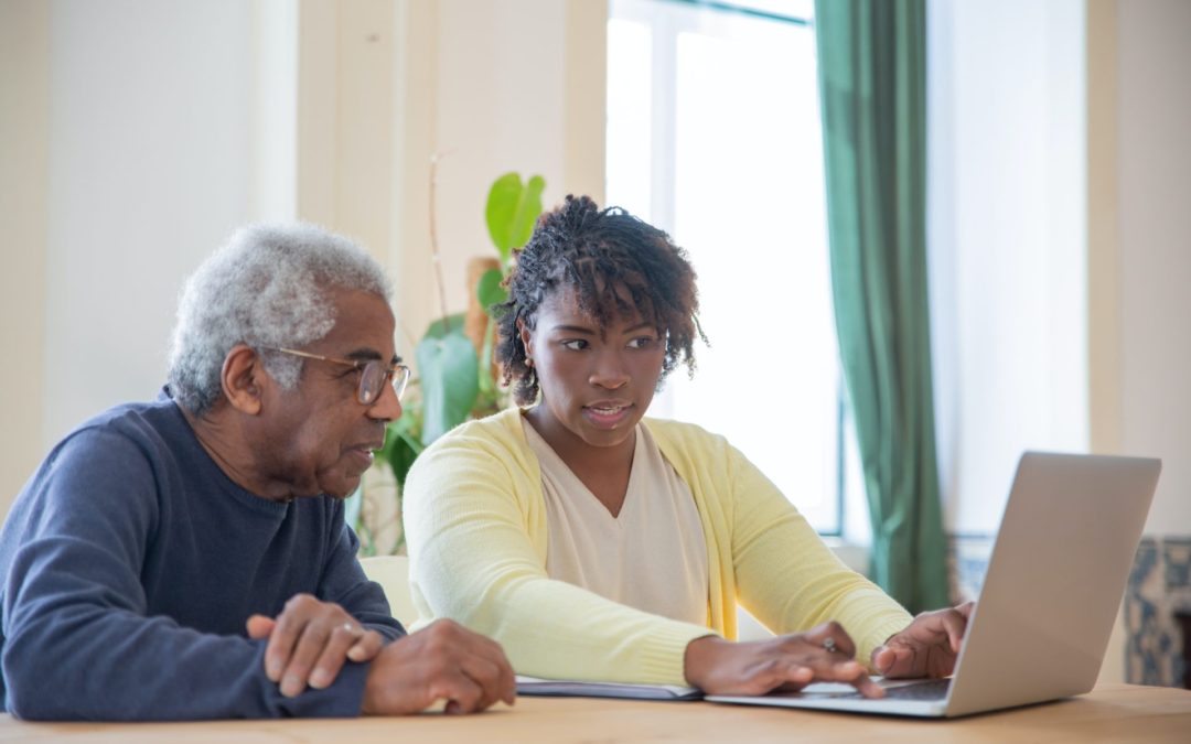 senior researching costs fo affordable senior care on laptop